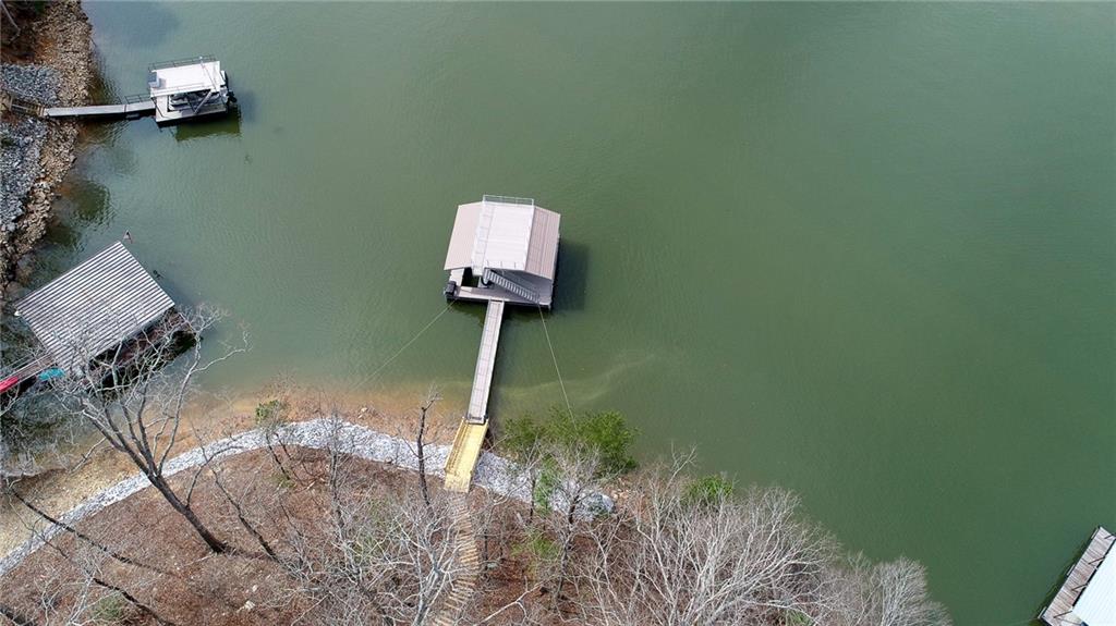 3339 Cove Overlook Road Gainesville, GA 30501 - Photo 4 of 67 a room with a wooden floor and a chair
