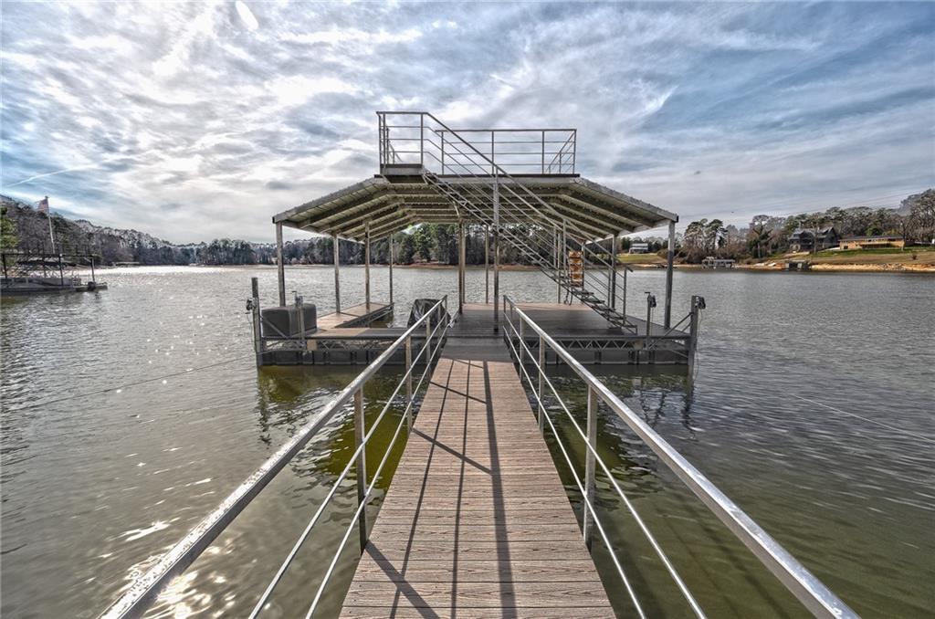 3339 Cove Overlook Road Gainesville, GA 30501 - Photo 43 of 67 a view of a balcony with wooden floor and lake view