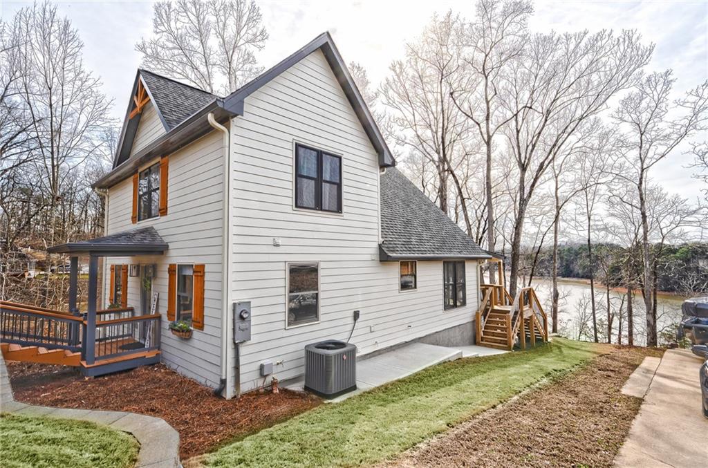 3339 Cove Overlook Road Gainesville, GA 30501 - Photo 54 of 67 a view of a house with a yard