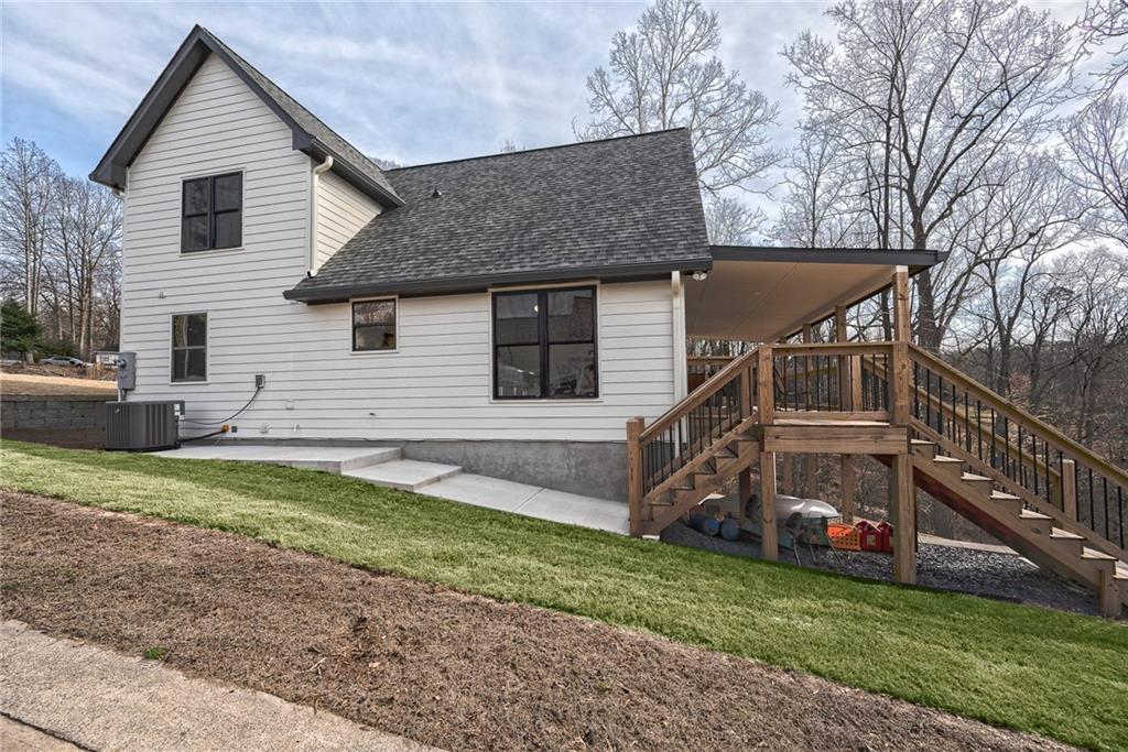 3339 Cove Overlook Road Gainesville, GA 30501 - Photo 55 of 67 a view of a house with a yard