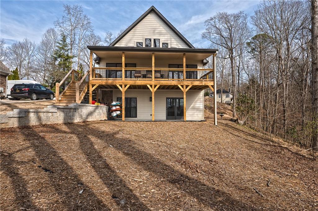 3339 Cove Overlook Road Gainesville, GA 30501 - Photo 57 of 67 a view of a house with a yard and garage