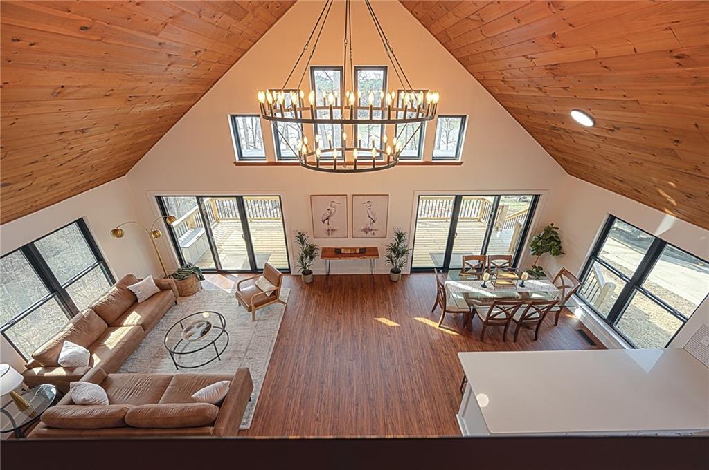 3339 Cove Overlook Road Gainesville, GA 30501 - Photo 6 of 67 a living room with furniture and a chandelier