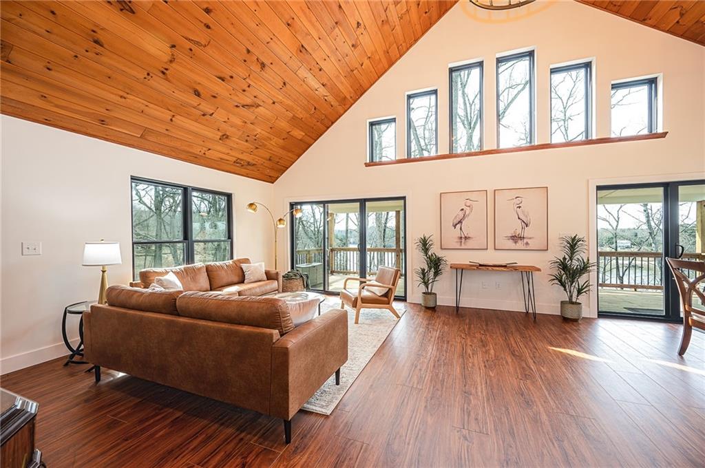3339 Cove Overlook Road Gainesville, GA 30501 - Photo 8 of 67 a living room with furniture and a large window