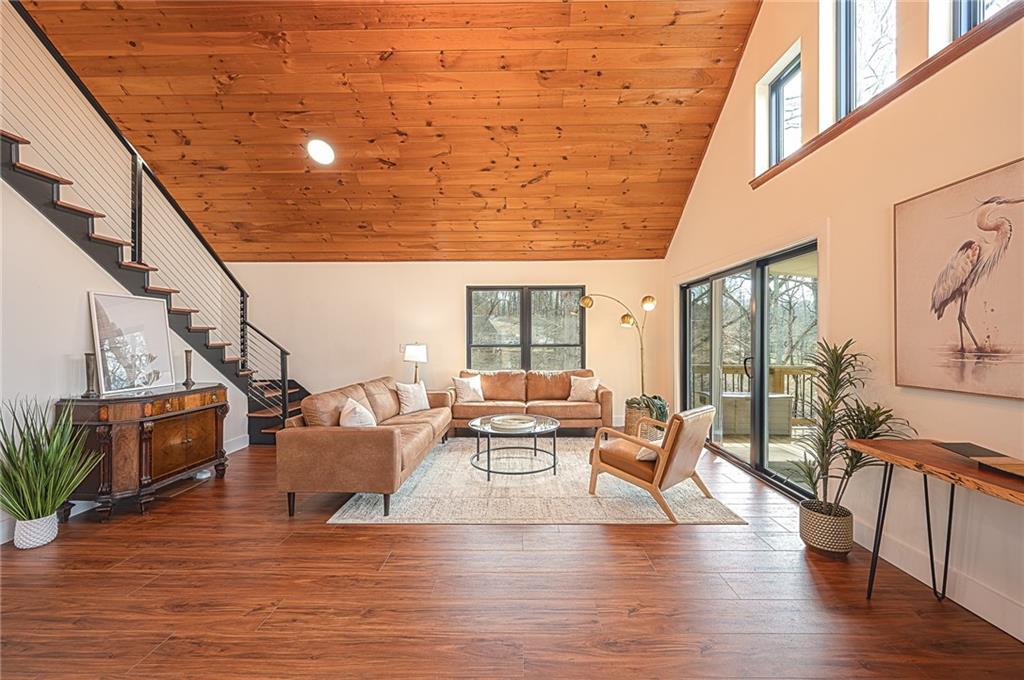 3339 Cove Overlook Road Gainesville, GA 30501 - Photo 9 of 67 a living room with furniture and wooden floor
