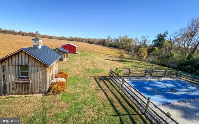 a large kitchen with lots of counter space and wooden floor