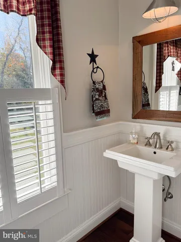 a kitchen with stainless steel appliances a refrigerator and a window
