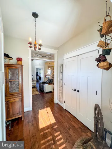 a view of a room with wooden floor and closet