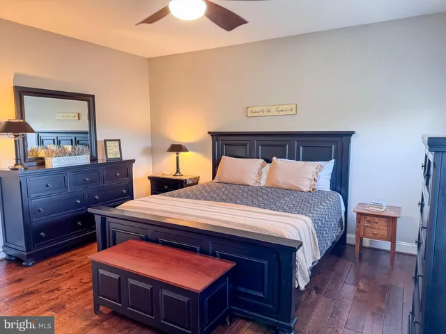 a bed room with a bed and a flat screen tv