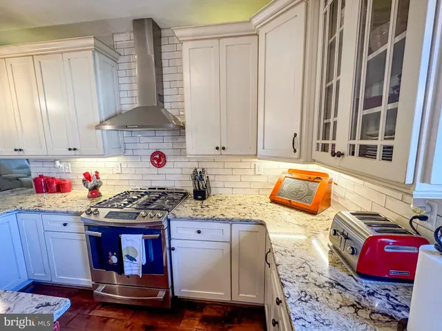 a view of a room with wooden furniture