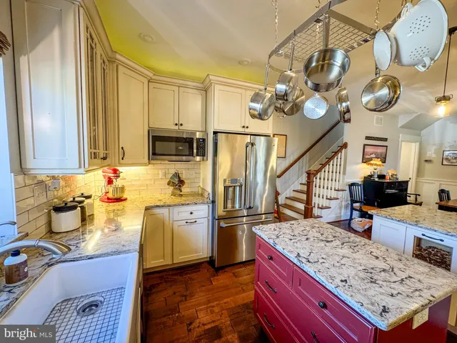 a view of a swimming pool with a backyard and trees