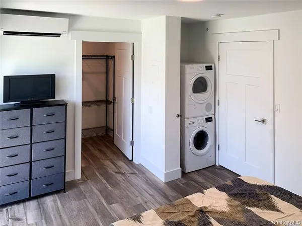 a view of a storage & utility room with wooden floor