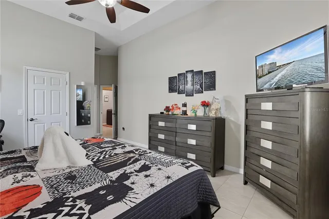 a bedroom with a bed and cabinets