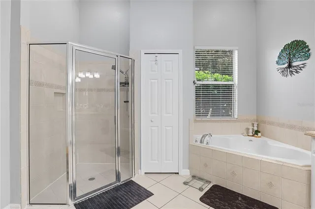 a bathroom with a bathtub and shower
