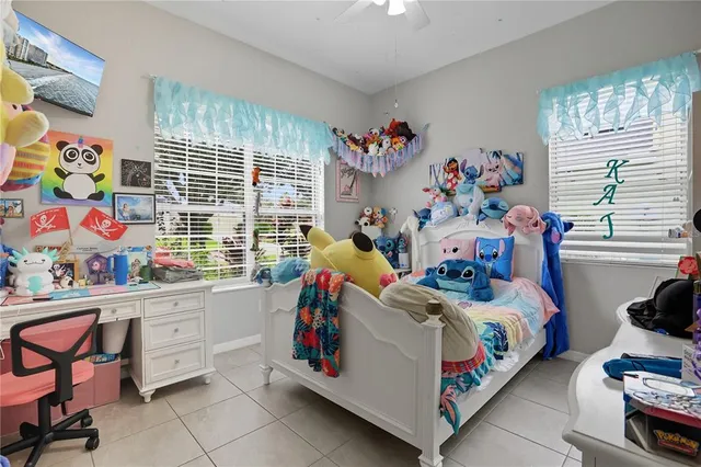 a bed room with furniture and a window