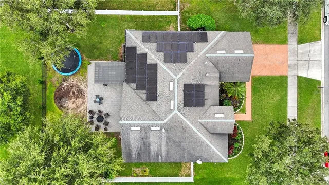 an aerial view of a house with a garden