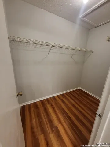 a view of a room with racks on the wall