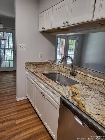 a kitchen with a refrigerator stove and microwave