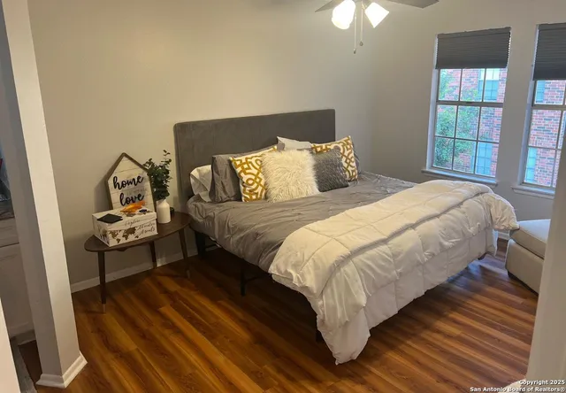 a white toilet sitting next to a bath tub
