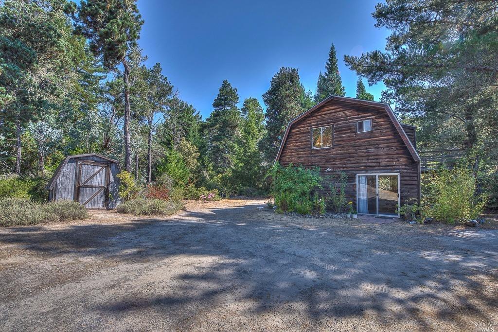 27770 Tenmile Road Point Arena, CA 95468 - Photo 1 of 1 Set well back from the road in total privacy. Lower level is currently one bedroom and office work space. Two bedroom septic. Storage shed to the left side. Very sunny location on east side of ridge road.