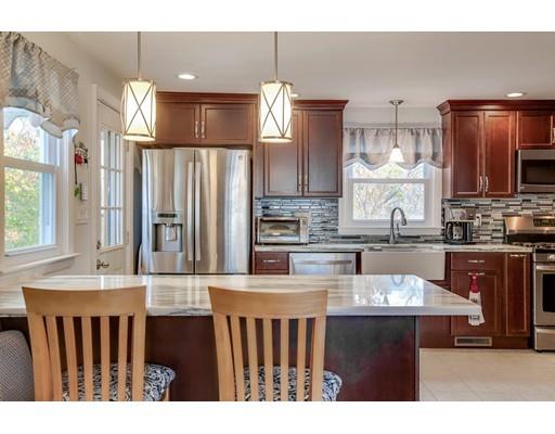 10 Riverside Road Billerica, MA 01821 - Photo 2 of 28 a kitchen with kitchen island granite countertop a sink cabinets and stainless steel appliances