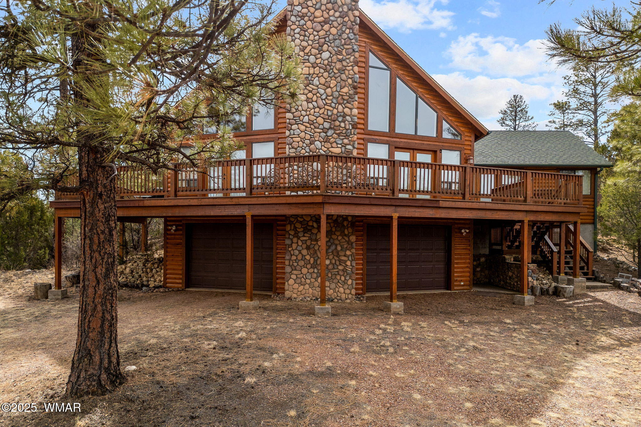 2851 Rockledge Road Heber, AZ 85928 - Photo 3 of 47 a view of a house with large windows and a small yard