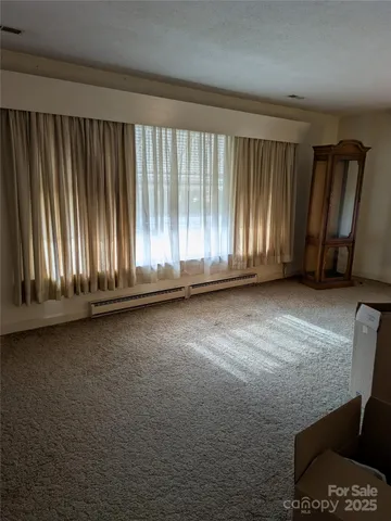 a view of wooden floor and windows in a room
