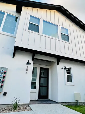 a view of front a house with sign board