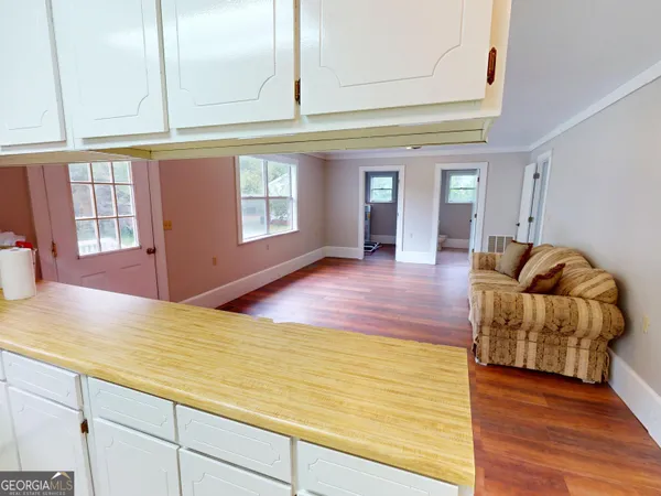 a view of livingroom with furniture wooden floor and window