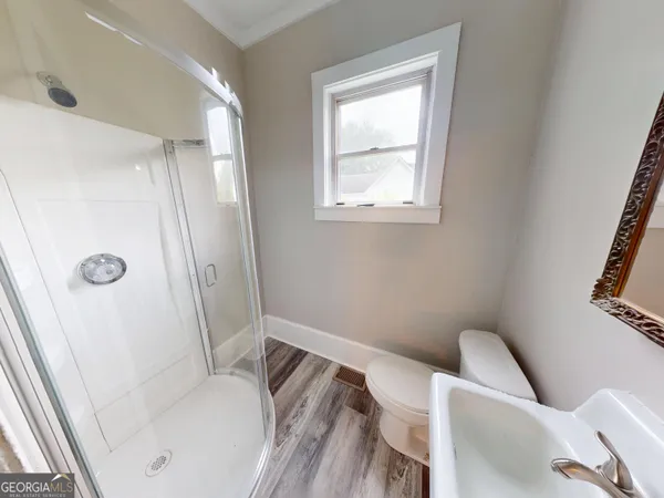 a bathroom with a tub toilet and sink