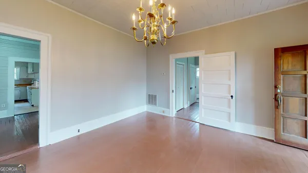 a view of livingroom with window and hardwood floor