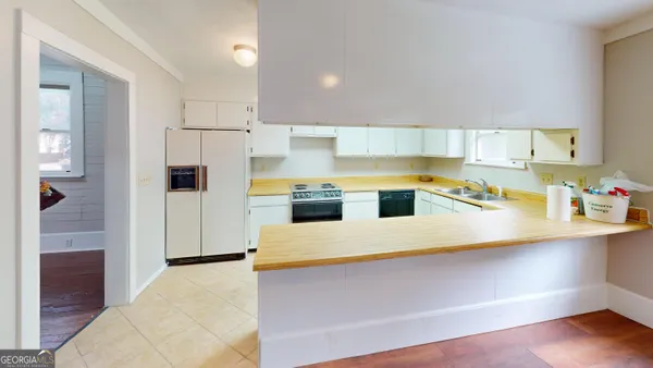 a kitchen with a stove and a sink