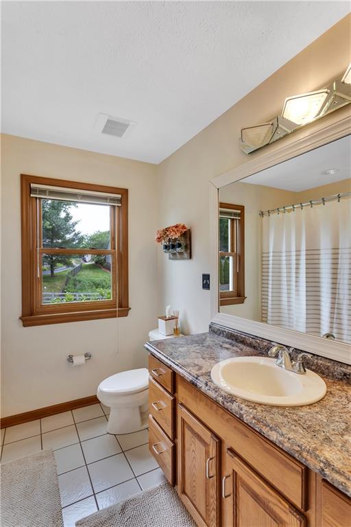 3 Sarah Court Irwin, PA 15642 - Photo 27 of 36 Hallway Bath with Large Vanity, Tile Floor and Tub/Shower Combo.