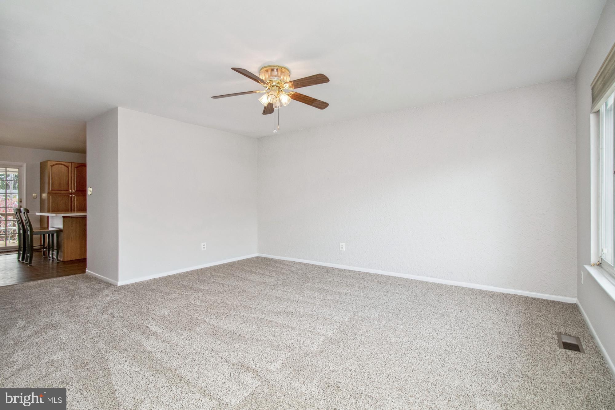 7909 Gray Haven Road Dundalk, MD 21222 - Photo 6 of 43 Large Open Living Room with fresh Carpet and Paint