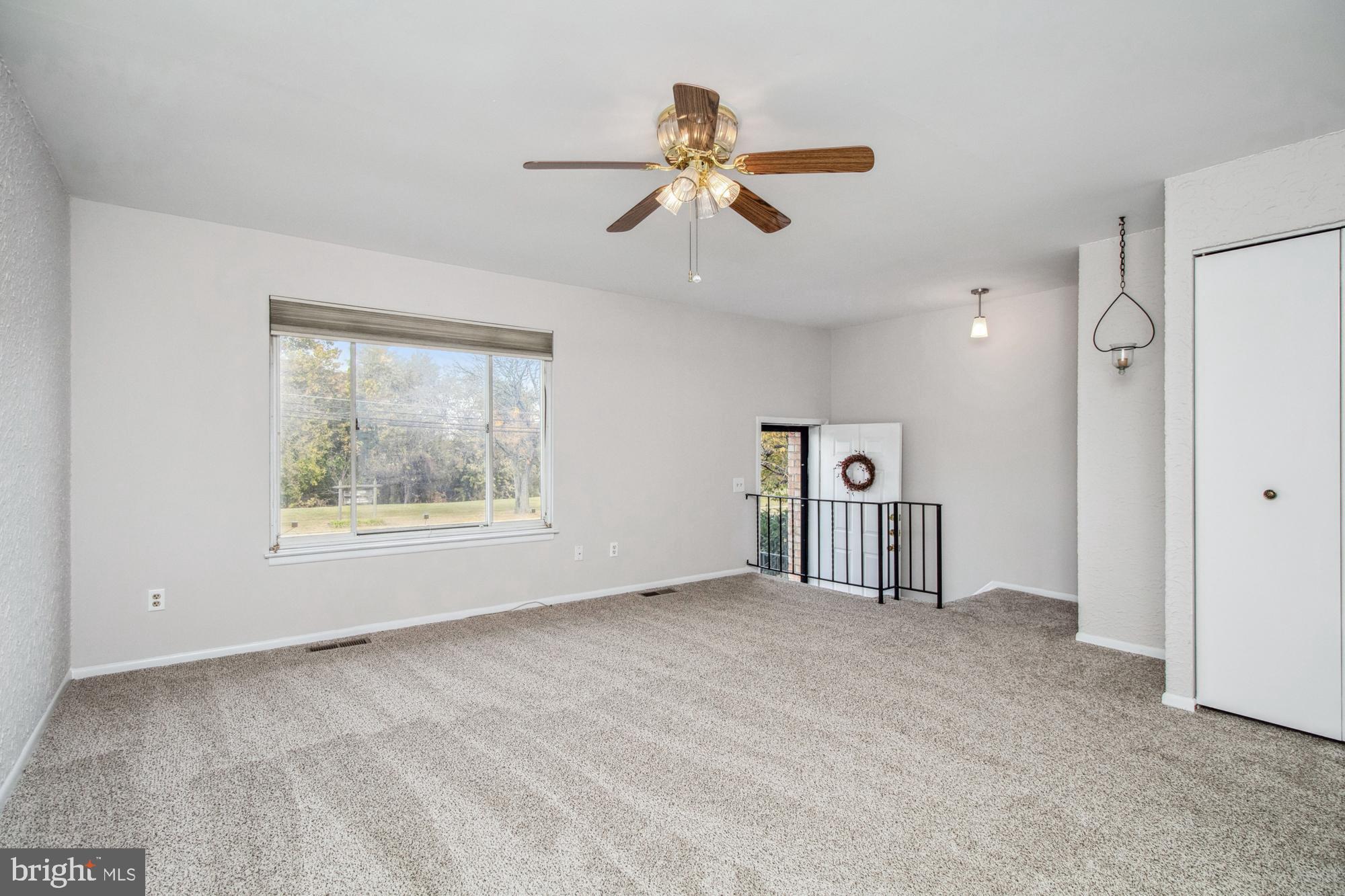 7909 Gray Haven Road Dundalk, MD 21222 - Photo 9 of 43 Large Open Living Room with fresh Carpet and Paint