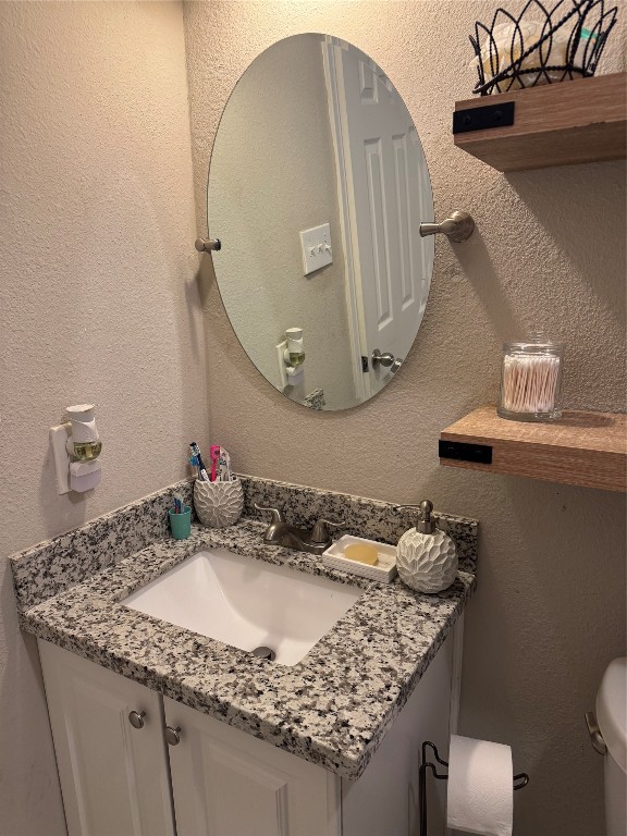 632 Sharon Street Prairie View, TX 77484 - Photo 7 of 15 a bathroom with a granite countertop sink a mirror and vanity