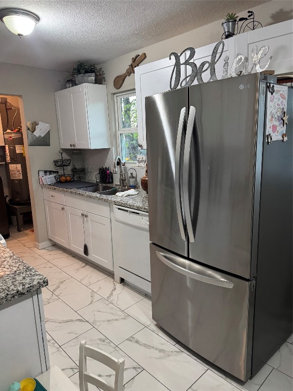 632 Sharon Street Prairie View, TX 77484 - Photo 8 of 15 a kitchen with stainless steel appliances granite countertop a refrigerator sink and microwave