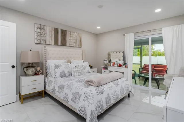 a bedroom with a bed and a table in it