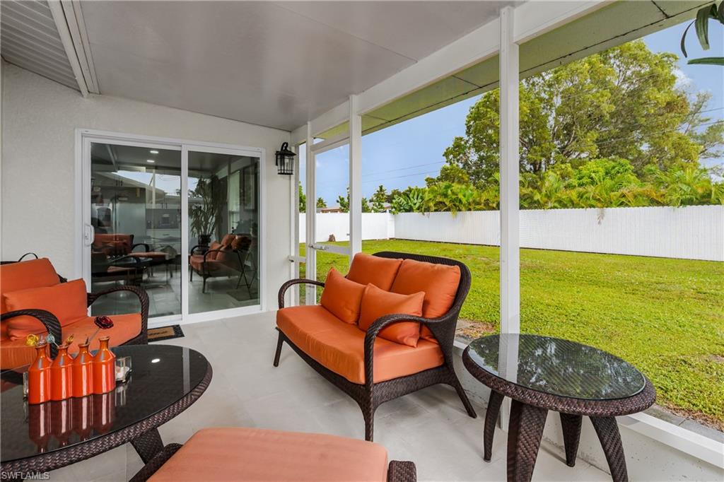 5170 19th Court Southwest Naples, FL 34116 - Photo 24 of 32 a outdoor living space with furniture and garden view