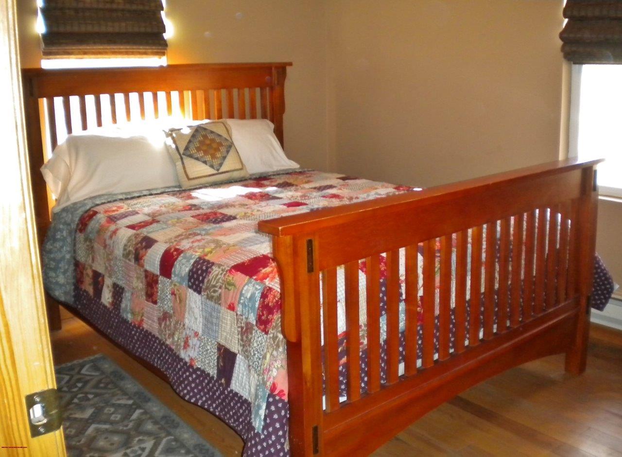 2369 County Road 23 Ridgway, CO 81432 - Photo 3 of 12 a bed sitting in a bedroom next to a window