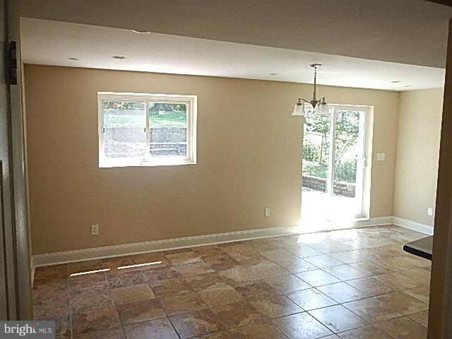 4406 Mahan Road Silver Spring, MD 20906 - Photo 2 of 12 a view of an empty room with a window