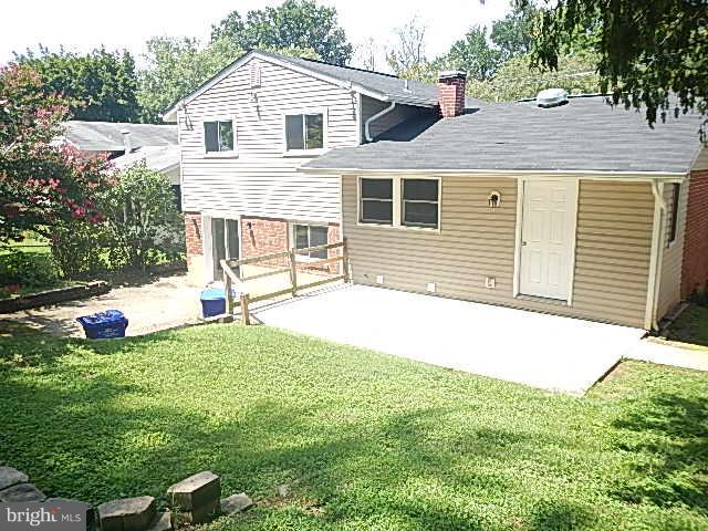4406 Mahan Road Silver Spring, MD 20906 - Photo 12 of 12 a front view of a house with a yard and garage