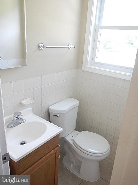 4406 Mahan Road Silver Spring, MD 20906 - Photo 6 of 12 a white toilet sitting next to a bathroom sink