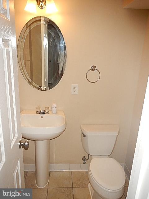 4406 Mahan Road Silver Spring, MD 20906 - Photo 10 of 12 a bathroom with a toilet sink and mirror
