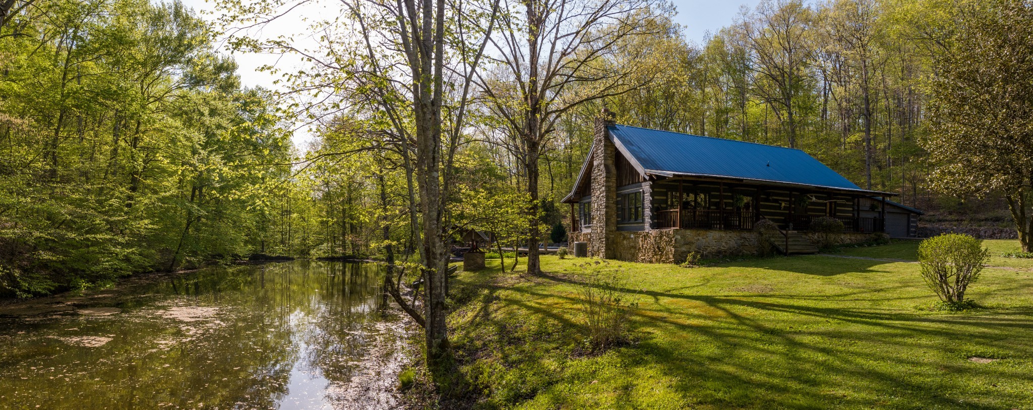 a yellow house with swimming pool in front of it