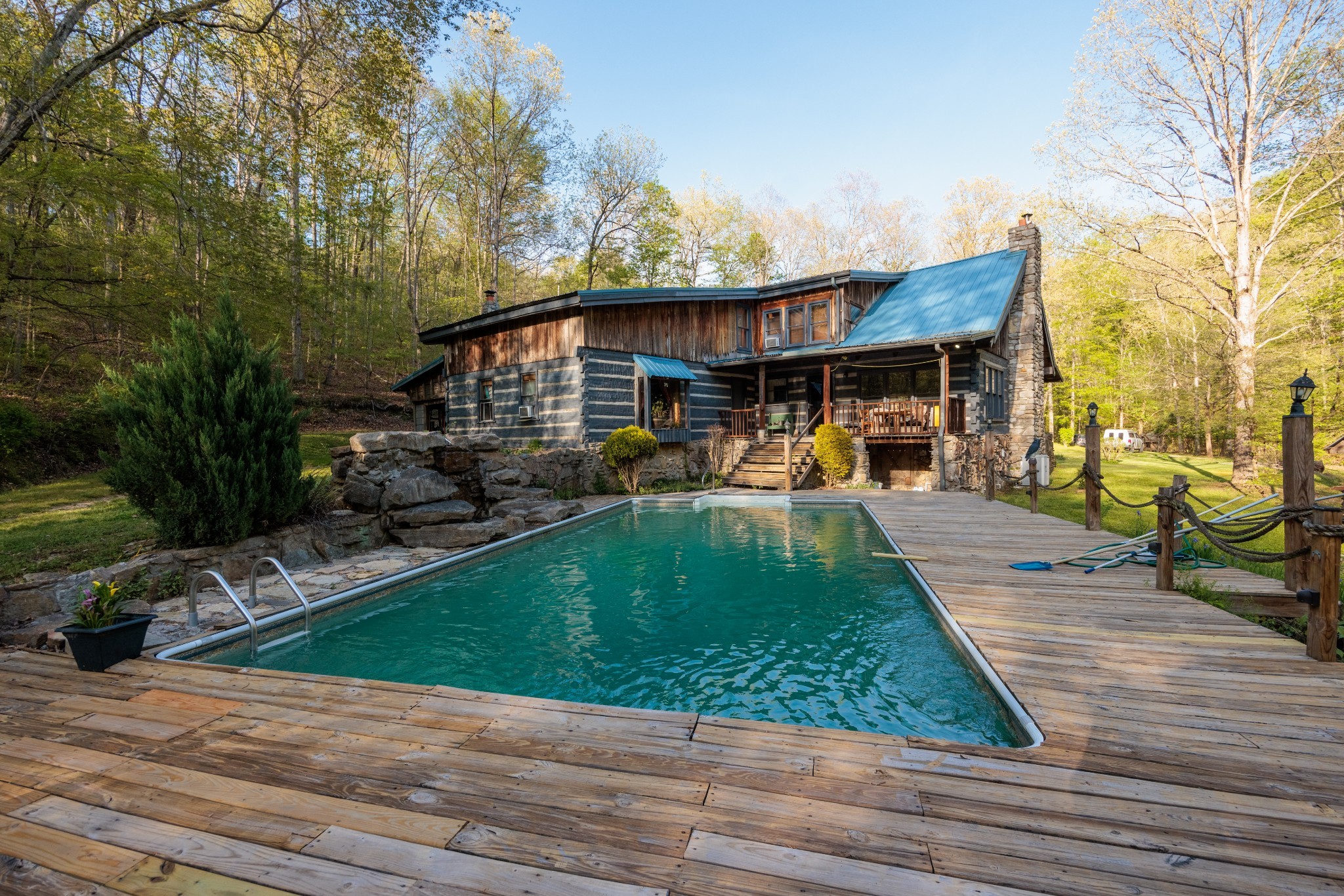 1056 West Sears Road Pegram, TN 37143 - Photo 14 of 61 a view of a patio with table and chairs with wooden floor and fence