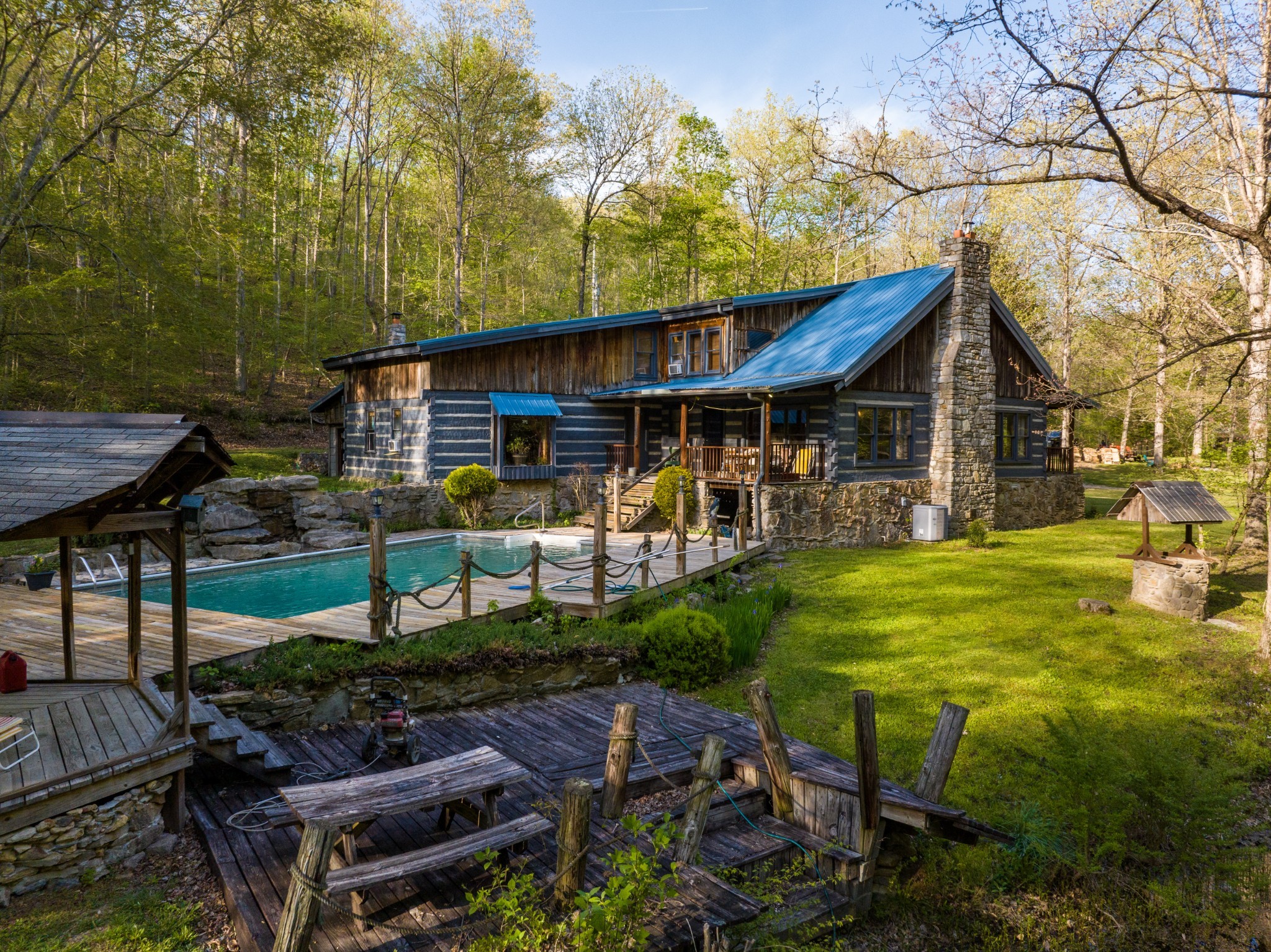 1056 West Sears Road Pegram, TN 37143 - Photo 21 of 61 a view of a patio with table and chairs potted plants and large tree