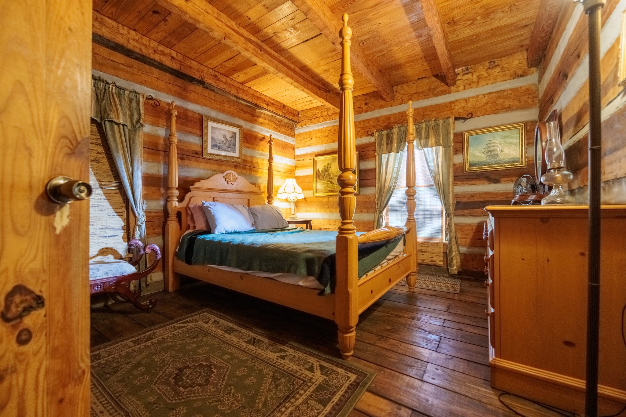 1056 West Sears Road Pegram, TN 37143 - Photo 52 of 61 a bedroom with a bed and wooden floor