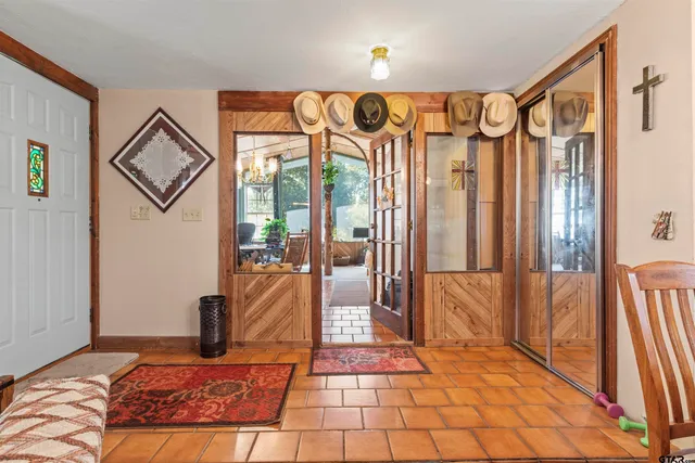 a bedroom with a bed and a mirror