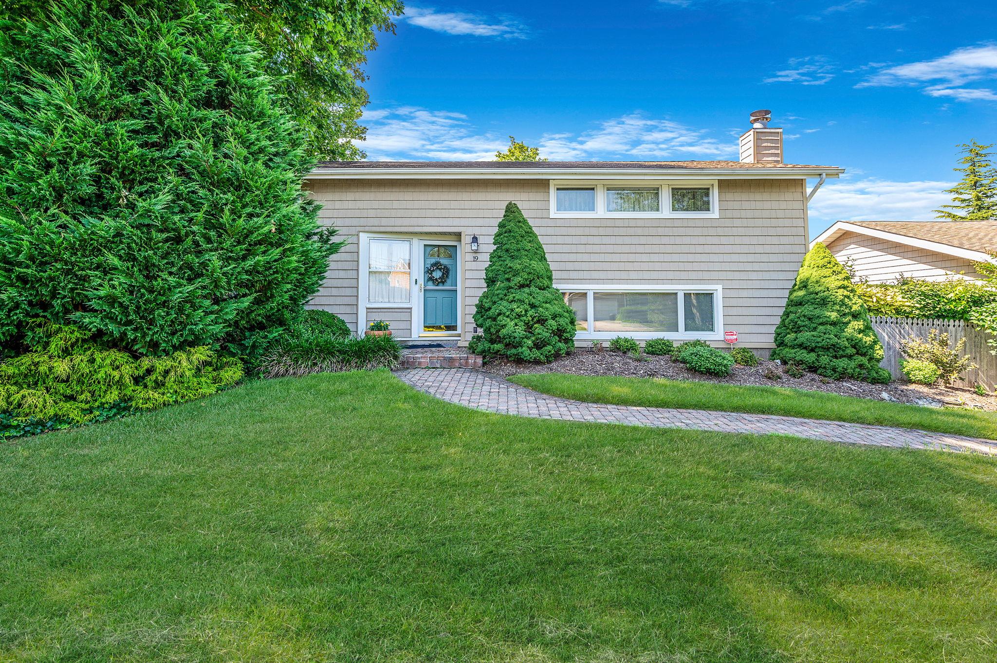 19 Coppertree Lane Babylon, NY 11702 - Photo 1 of 1 a front view of house with yard and green space