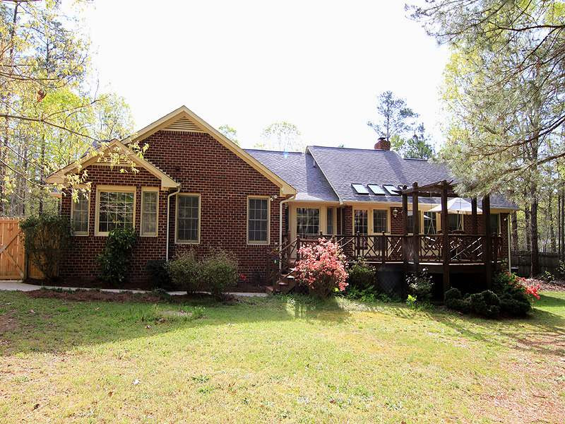 4117 Lassiter Road Wake Forest, NC 27587 - Photo 17 of 22 This well built home is all four sides brick and nestled on over two and a half acres. Exterior Back